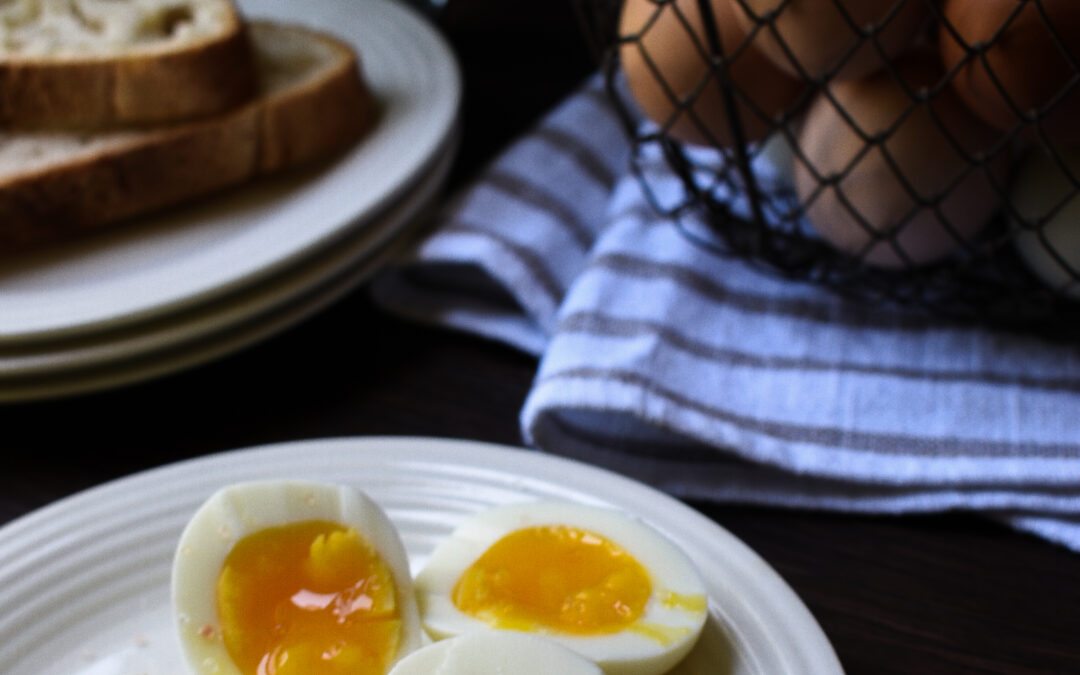 Soft boiled eggs cut open on plate