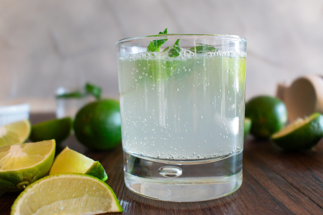 short glass filled with a sparkling lime drink