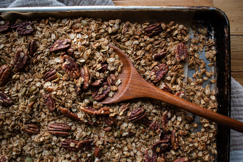 closeup shot of homemade granola on a sheet pan