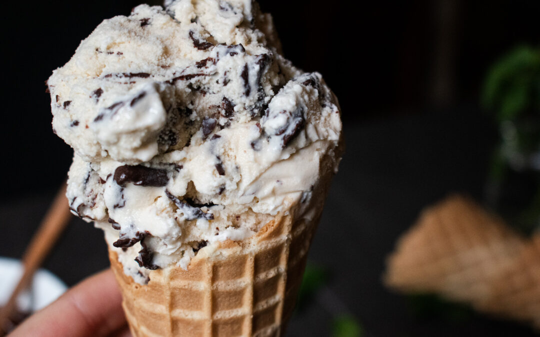 Close up shot of mint chocolate chip ice cream on a waffle cone