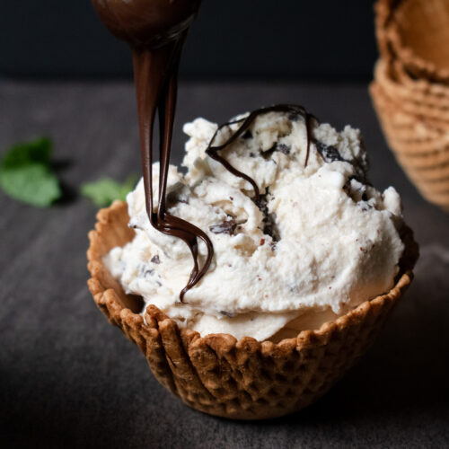 chocolate chip ice cream in waffle town being drizzled with chocolate