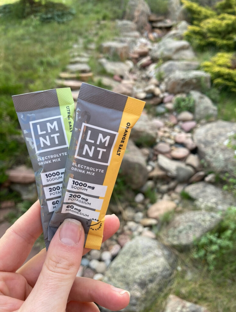 hand holding 2 packets of lmnt electrolytes